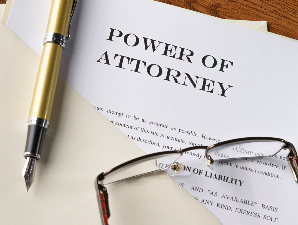 fountain pen, glasses and power of attorney file